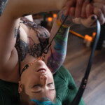 Person with short blue hair with BDSM collar at Wilmington, NC boudoir studio